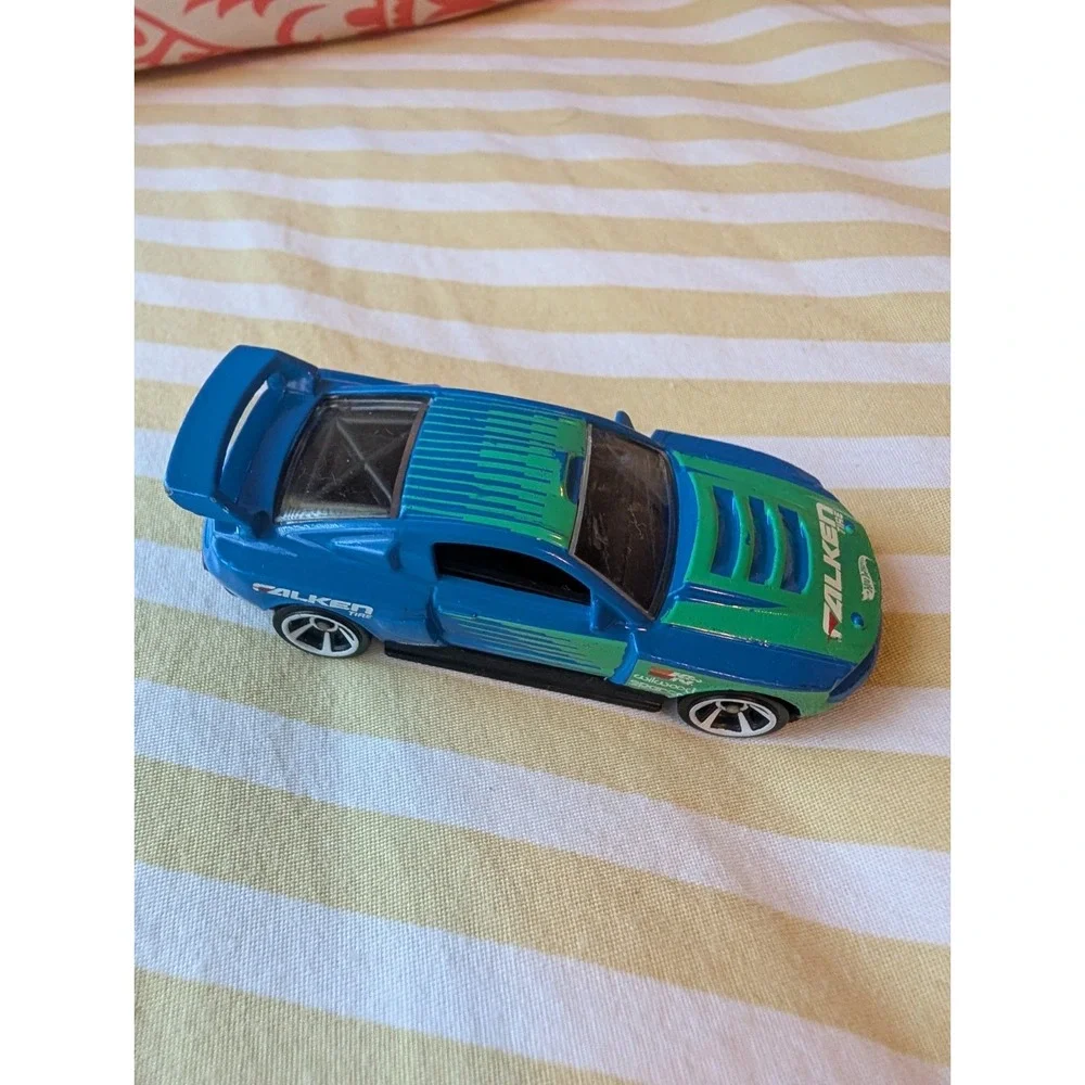 Hot Wheels 2011 Blue Custom '12 Ford Mustang Diecast Car Falken Tire 1:64 Scale